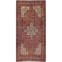A WOOL HAND KNOTTED MEDALLION RUG RUNNER.