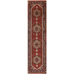 A WOOL HAND KNOTTED SERAPI ORIENTAL RUG RUNNER.