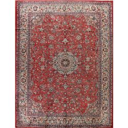 A WOOL HAND KNOTTED FLORAL ORIENTAL AREA RUG.