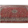 Image 9 : A WOOL HAND KNOTTED FLORAL ORIENTAL AREA RUG.