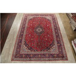 A WOOL HAND KNOTTED FLORAL ORIENTAL AREA RUG.