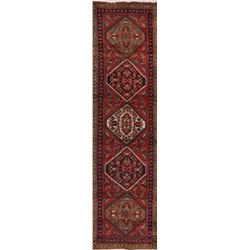 A WOOL HAND KNOTTED ORIENTAL RUG RUNNER.