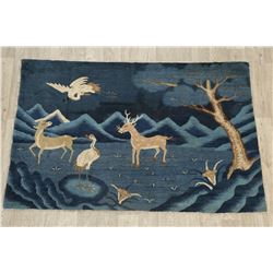 A WOOL HAND KNOTTED ORIENTAL AREA RUG.