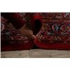 Image 11 : A WOOL HAND KNOTTED FLORAL MEDALLION AREA RUG.