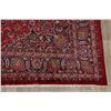 Image 6 : A WOOL HAND KNOTTED FLORAL MEDALLION AREA RUG.