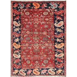 A WOOL HAND KNOTTED ORIENTAL AREA RUG.
