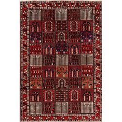 A WOOL HAND KNOTTED ORIENTAL AREA RUG.