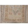 Image 12 : A WOOL HAND KNOTTED OUSHAK ORIENTAL AREA RUG.
