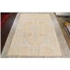 Image 2 : A WOOL HAND KNOTTED FLORAL OUSHAK AREA RUG.