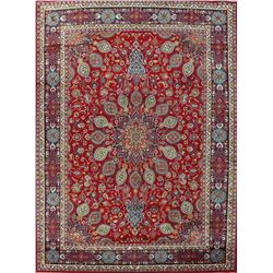 A WOOL HAND KNOTTED FLORAL ORIENTAL AREA RUG.