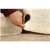 Image 12 : A WOOL HAND KNOTTED OUSHAK ORIENTAL AREA RUG.