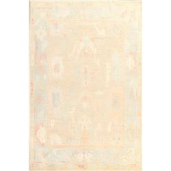 A WOOL HAND KNOTTED OUSHAK ORIENTAL AREA RUG.