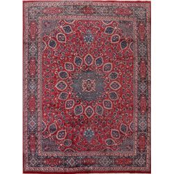 A WOOL HAND KNOTTED FLORAL ORIENTAL AREA RUG.
