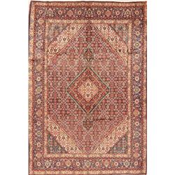 A WOOL HAND KNOTTED ORIENTAL AREA RUG.