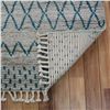 Image 7 : A WOOL HAND KNOTTED MOROCCAN AREA RUG.