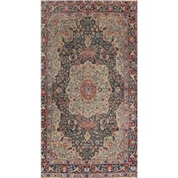 A WOOL HAND KNOTTED ORIENTAL AREA RUG.