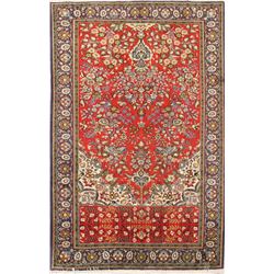 A WOOL HAND KNOTTED FLORAL ORIENTAL AREA RUG.
