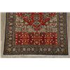 Image 8 : A WOOL HAND KNOTTED FLORAL ORIENTAL AREA RUG.