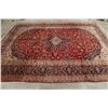 Image 9 : A WOOL HAND KNOTTED FLORAL ORIENTAL AREA RUG.
