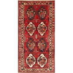 A WOOL HAND KNOTTED ORIENTAL AREA RUG.