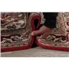 Image 12 : A WOOL HAND KNOTTED HERIZ ORIENTAL AREA RUG.