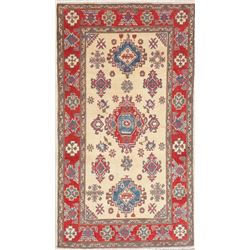 A WOOL HAND KNOTTED KAZAK ORIENTAL AREA RUG.