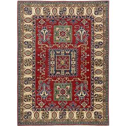 A WOOL HAND KNOTTED KAZAK ORIENTAL AREA RUG.