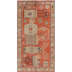 A WOOL HAND KNOTTED ORIENTAL AREA RUG.