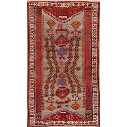 A WOOL HAND KNOTTED KASHKOLI ORIENTAL AREA RUG.