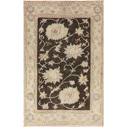 A WOOL HAND KNOTTED FLORAL ORIENTAL AREA RUG.