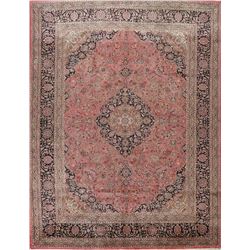 A WOOL HAND KNOTTED FLORAL ORIENTAL AREA RUG.