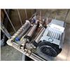 Image 1 : Electric motor, large drill bits and pneumatic cylinders