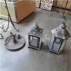 Two decorative metal lanterns and hanging bird feeder