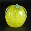 Image 1 : PAPERWEIGHT: Apple-shaped unsigned paperweight with a clear exterior. The interior is filled with fo