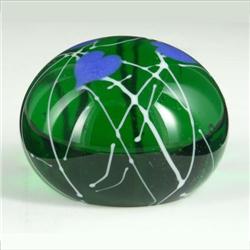 PAPERWEIGHT: Iridescent green paperweight with irregular spider-web like lines. The surface has thre