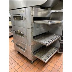 Lincoln Model 1600 Gas Triple Deck Gas Conveyor Pizza Oven . Sold with custom size hood exhaust (dis