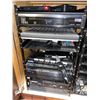 Image 10 : Rack of all audio video components including power amps, cable boxes, modems, etc