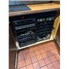 Image 1 : Rack of all audio video components including power amps, cable boxes, modems, etc