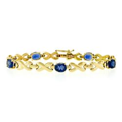 14kt Yellow Gold 6.00 ctw Oval Iolite Puffed X & O Link Tennis Bracelet