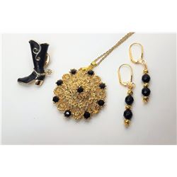 17)  GOLD TONE AND BLACK CRYSTAL