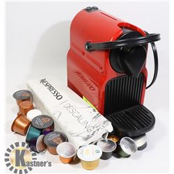 NESPRESSO MACHINE WITH SOME PODS AND