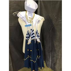 Blue and white sailors costumer with golden necklace and a sailors hat