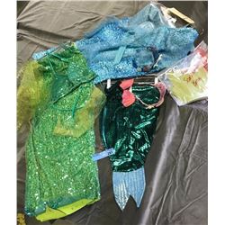 multiple mermaid costumes (green and blue)