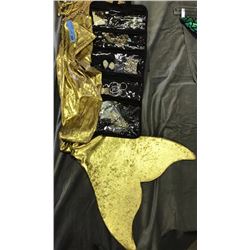 Golden mermaid costumes complete with fin and bead necklaces, earrings and other jewelry