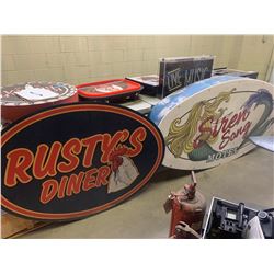 Large lighted Siren song hotel sign and rusty's diner sign