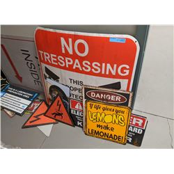 A room full of signs, police signs, restaurant signs and misc other signs