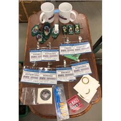 2 cups, multiple room keys with siren song motel tags, multiple ukraine office name badges and misc