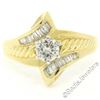 Image 1 : 18kt Yellow and White Gold 0.90 ctw Round and Baguette Diamond Ring