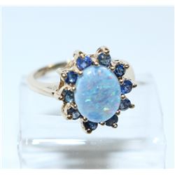 Lady's 10K Yellow Gold Opal & Topaz Ring - Size 6. Total weight of 3.84 grams.