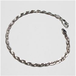 Lady's 10K White Gold Braided Bracelet with Lobster Clasp. Measures 7 1/4" in length with a weight o